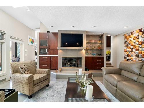 10931 Willowfern Drive Se, Calgary, AB - Indoor Photo Showing Living Room With Fireplace