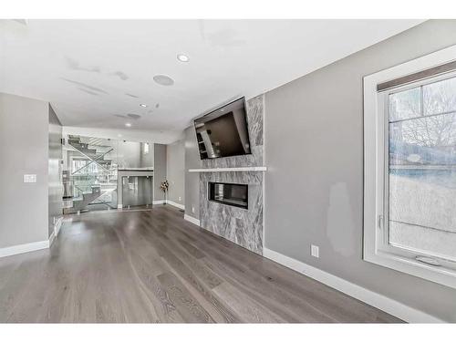 1808 8 Street Sw, Calgary, AB - Indoor Photo Showing Other Room With Fireplace