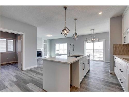 26 Hanson Drive, Langdon, AB - Indoor Photo Showing Kitchen With Upgraded Kitchen