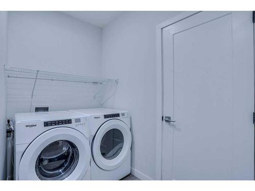 24 Corner Meadows Row Ne, Calgary, AB - Indoor Photo Showing Laundry Room