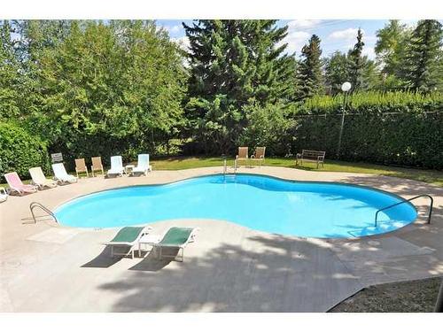606,607-3316 Rideau Place Sw, Calgary, AB - Outdoor With In Ground Pool With Backyard