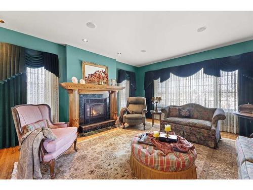 2014 20 Avenue, Didsbury, AB - Indoor Photo Showing Living Room With Fireplace