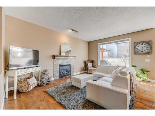 496 Everbrook Way Sw, Calgary, AB - Indoor Photo Showing Living Room With Fireplace