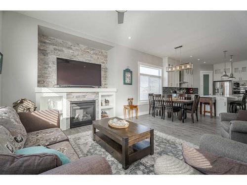 1411 Price Close, Carstairs, AB - Indoor Photo Showing Living Room With Fireplace