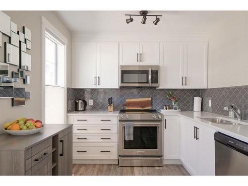 139 Cranbrook Walk Se, Calgary, AB - Indoor Photo Showing Kitchen With Double Sink