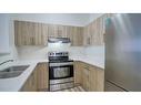 2312-1140 Taradale Drive Ne, Calgary, AB  - Indoor Photo Showing Kitchen With Stainless Steel Kitchen With Double Sink 