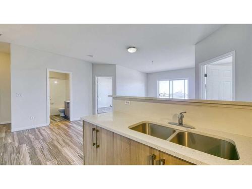 2312-1140 Taradale Drive Ne, Calgary, AB - Indoor Photo Showing Kitchen With Double Sink