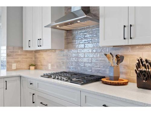 435 Rivercrest Boulevard, Cochrane, AB - Indoor Photo Showing Kitchen With Upgraded Kitchen