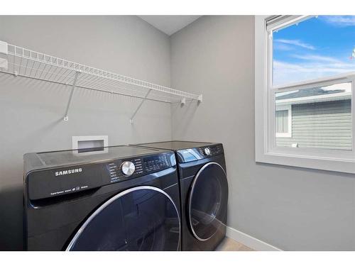 435 Rivercrest Boulevard, Cochrane, AB - Indoor Photo Showing Laundry Room