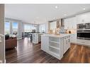 435 Rivercrest Boulevard, Cochrane, AB  - Indoor Photo Showing Kitchen With Upgraded Kitchen 