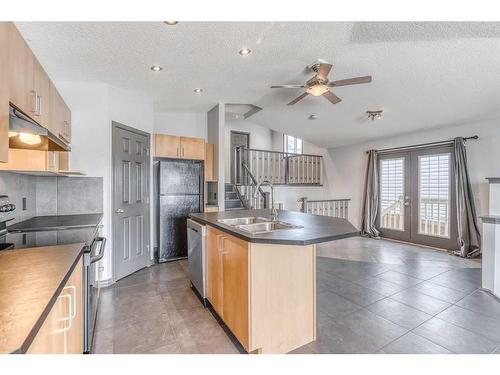 6 Bridlecrest Boulevard Sw, Calgary, AB - Indoor Photo Showing Kitchen With Double Sink