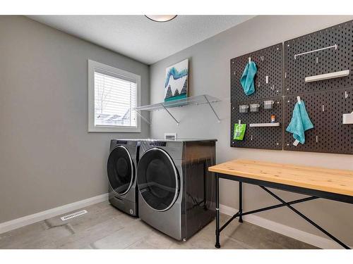 419 Rivercrest Boulevard, Cochrane, AB - Indoor Photo Showing Laundry Room