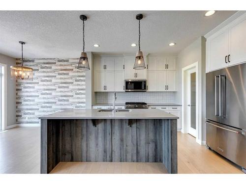 419 Rivercrest Boulevard, Cochrane, AB - Indoor Photo Showing Kitchen With Upgraded Kitchen