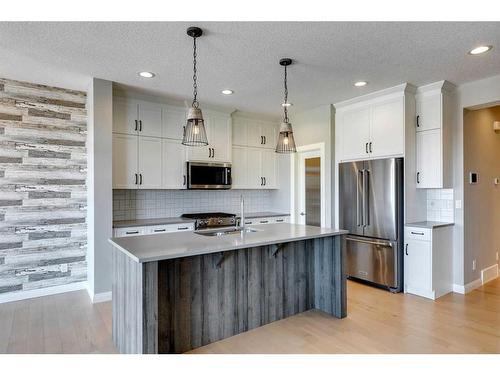 419 Rivercrest Boulevard, Cochrane, AB - Indoor Photo Showing Kitchen With Stainless Steel Kitchen With Upgraded Kitchen