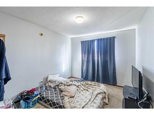 50 Tararidge Drive Ne, Calgary, AB - Indoor Photo Showing Bedroom