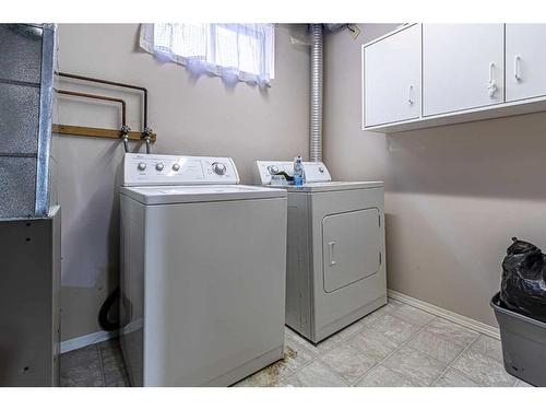 50 Tararidge Drive Ne, Calgary, AB - Indoor Photo Showing Laundry Room