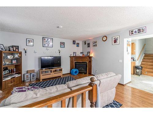 50 Tararidge Drive Ne, Calgary, AB - Indoor Photo Showing Other Room With Fireplace