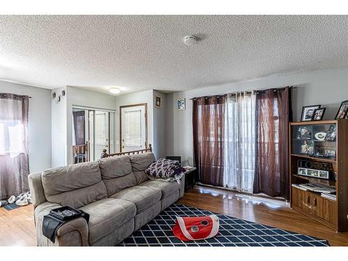 50 Tararidge Drive Ne, Calgary, AB - Indoor Photo Showing Living Room