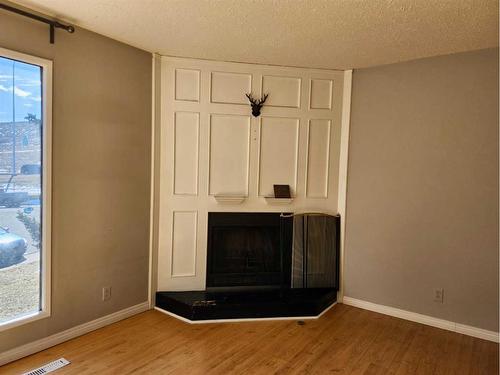 55 Beaconsfield Crescent Nw, Calgary, AB - Indoor Photo Showing Other Room With Fireplace