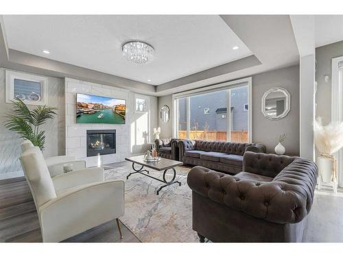 137 Cityside Road Ne, Calgary, AB - Indoor Photo Showing Living Room With Fireplace