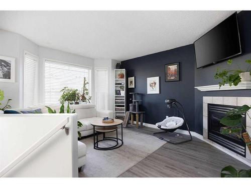 205 Kodiak Crescent, Fort Mcmurray, AB - Indoor Photo Showing Living Room With Fireplace