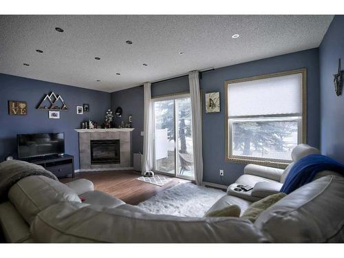 92 Somervale Park Sw, Calgary, AB - Indoor Photo Showing Living Room With Fireplace