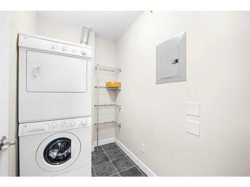 408-201 Sunset Drive, Cochrane, AB - Indoor Photo Showing Laundry Room