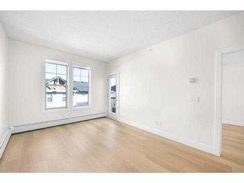 408-201 Sunset Drive, Cochrane, AB - Indoor Photo Showing Other Room