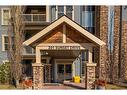408-201 Sunset Drive, Cochrane, AB  - Outdoor With Facade 