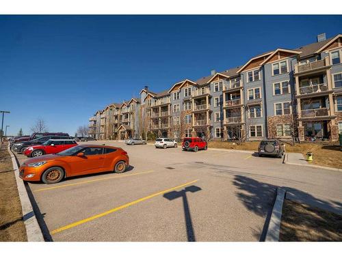 408-201 Sunset Drive, Cochrane, AB - Outdoor With Facade