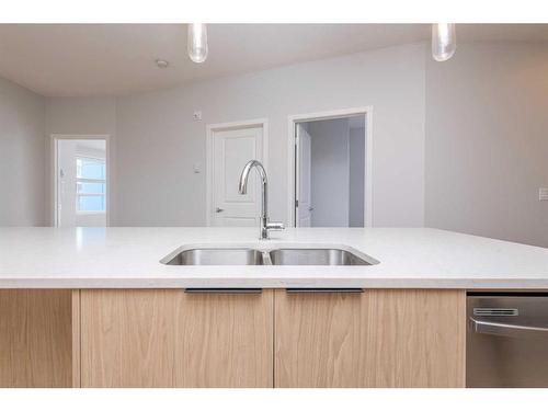 2206-19489 Main Street Se, Calgary, AB - Indoor Photo Showing Kitchen With Double Sink