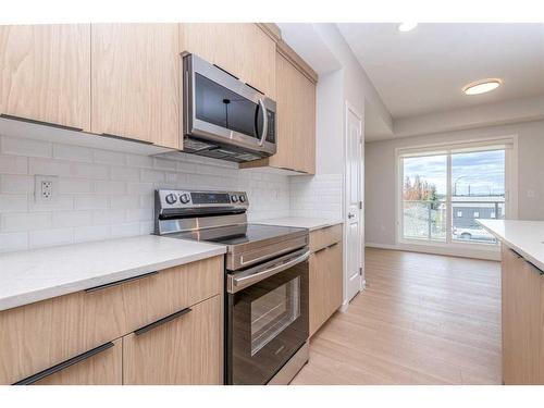 2206-19489 Main Street Se, Calgary, AB - Indoor Photo Showing Kitchen With Stainless Steel Kitchen With Upgraded Kitchen
