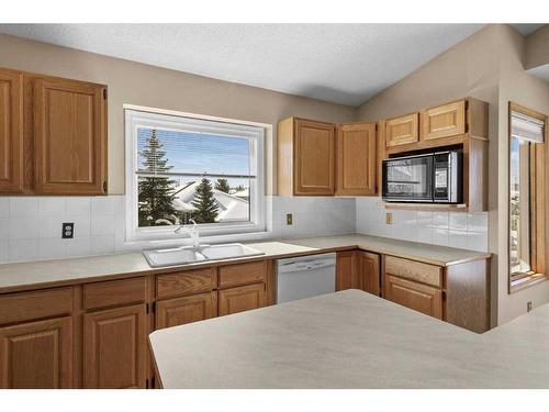 123 Scenic Ridge Court Nw, Calgary, AB - Indoor Photo Showing Kitchen With Double Sink