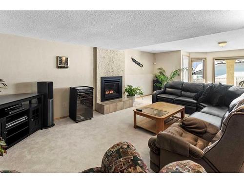 123 Scenic Ridge Court Nw, Calgary, AB - Indoor Photo Showing Living Room With Fireplace