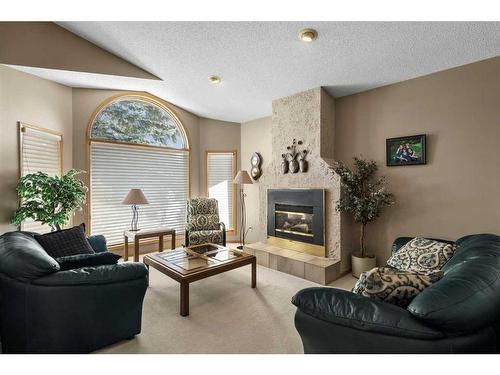 123 Scenic Ridge Court Nw, Calgary, AB - Indoor Photo Showing Living Room With Fireplace
