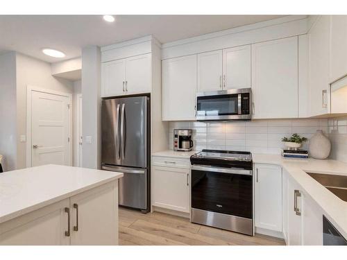 401-8355 19 Avenue Sw, Calgary, AB - Indoor Photo Showing Kitchen With Stainless Steel Kitchen With Upgraded Kitchen