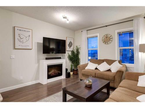 254 Silverado Common Sw, Calgary, AB - Indoor Photo Showing Living Room With Fireplace