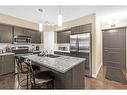 105-15207 1 Street Se, Calgary, AB  - Indoor Photo Showing Kitchen With Double Sink With Upgraded Kitchen 