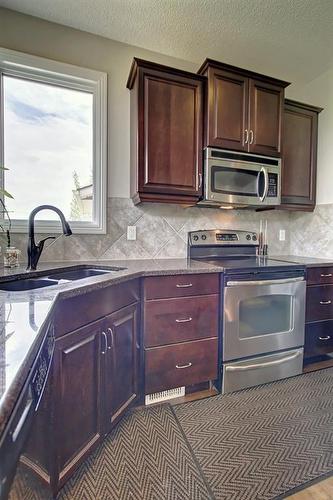 116 Kincora Hill Nw, Calgary, AB - Indoor Photo Showing Kitchen With Double Sink