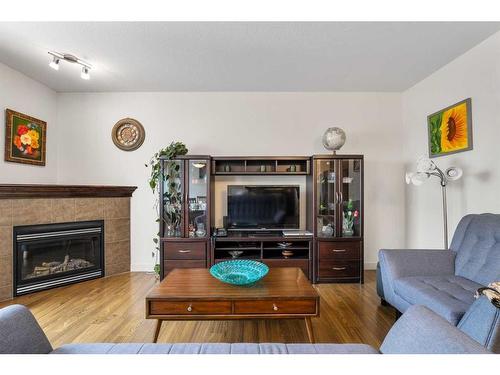 39 Everwoods Park Sw, Calgary, AB - Indoor Photo Showing Living Room With Fireplace