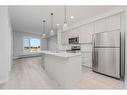 111-200 Shawnee Square Sw, Calgary, AB  - Indoor Photo Showing Kitchen With Upgraded Kitchen 