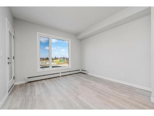 111-200 Shawnee Square Sw, Calgary, AB - Indoor Photo Showing Other Room