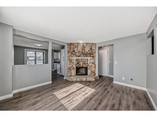 111 Pinemill Mews Ne, Calgary, AB - Indoor Photo Showing Living Room With Fireplace