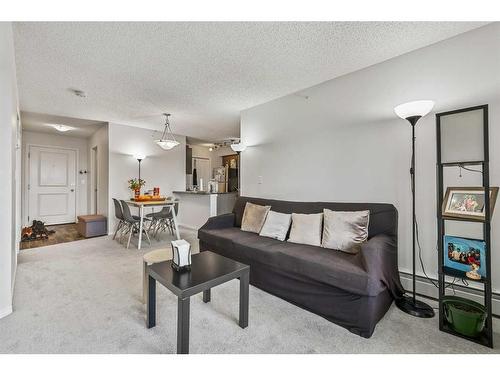 1424-81 Legacy Boulevard Se, Calgary, AB - Indoor Photo Showing Living Room
