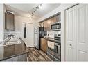 1424-81 Legacy Boulevard Se, Calgary, AB  - Indoor Photo Showing Kitchen With Double Sink 