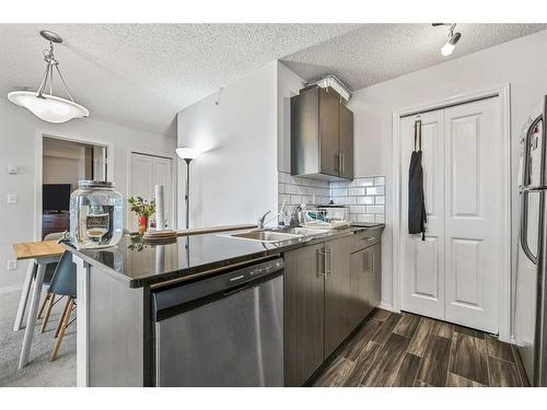 1424-81 Legacy Boulevard Se, Calgary, AB - Indoor Photo Showing Kitchen With Stainless Steel Kitchen With Double Sink With Upgraded Kitchen