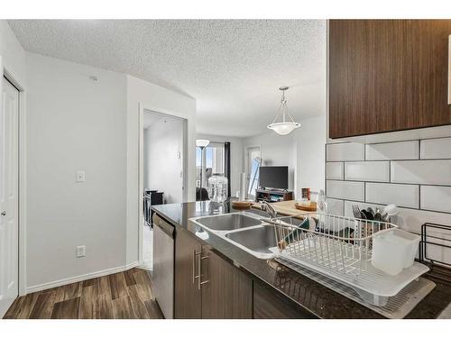 1424-81 Legacy Boulevard Se, Calgary, AB - Indoor Photo Showing Kitchen With Double Sink With Upgraded Kitchen