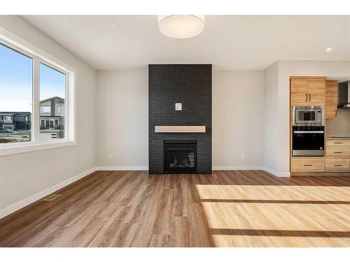 229 Precedence View, Cochrane, AB - Indoor With Fireplace