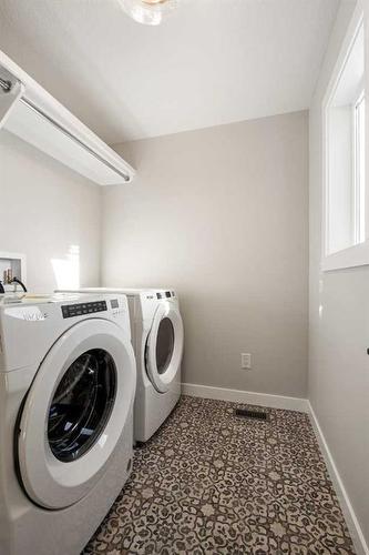 229 Precedence View, Cochrane, AB - Indoor Photo Showing Laundry Room