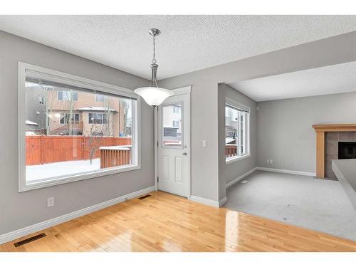 51 Everbrook Link Sw, Calgary, AB - Indoor With Fireplace